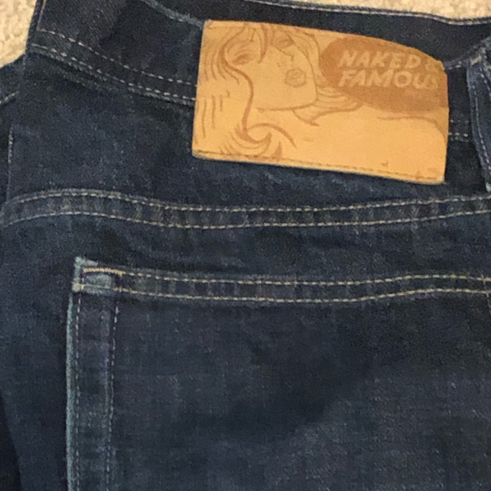 Men’s Naked and Famous “weird guy” dark wash. Great condition